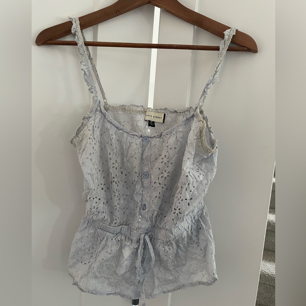 Embroidered seersucker like garment. Perfect for the warmer temperatures.